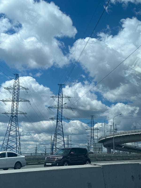 Highway drive past power infrastructure and an Orthodox church