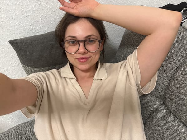 Woman rests on couch in Kőröshegy, Hungary