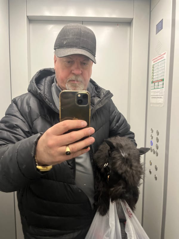 Man takes elevator selfie with small dog in Podolsk