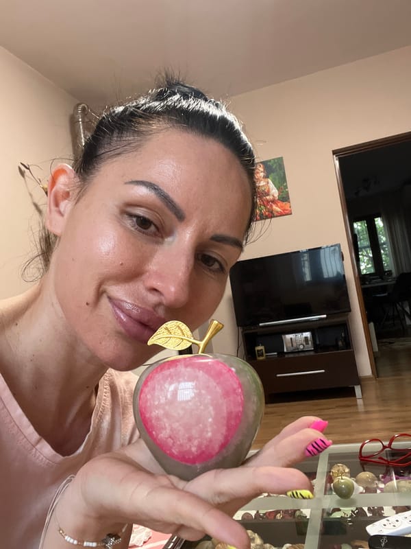 Woman photographs decorative object, artwork displayed in Stara Zagora