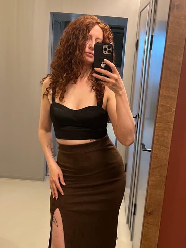 Woman takes mirror selfie in Saint Petersburg bathroom