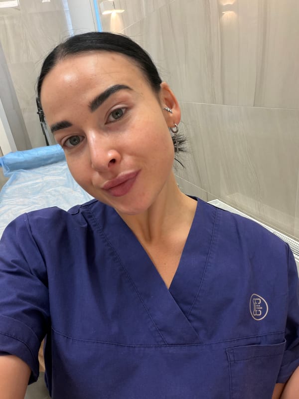 Healthcare worker holds walnut in medical room, Saint Petersburg