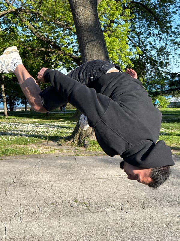 Men perform backflips, visit beach during afternoon in Varna