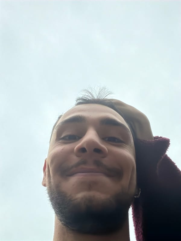 Selfie captured in Milan shows man in burgundy hoodie