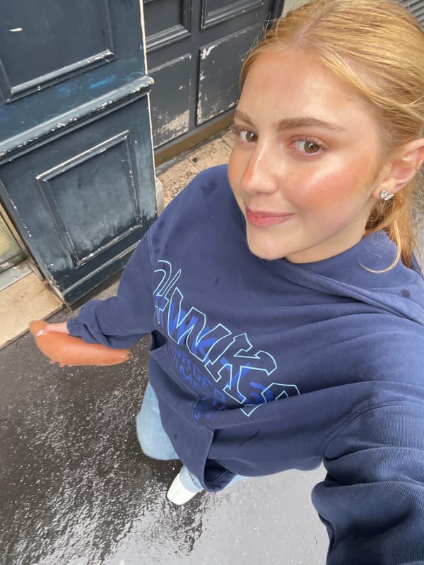 Woman in navy hoodie spotted at multiple Paris locations