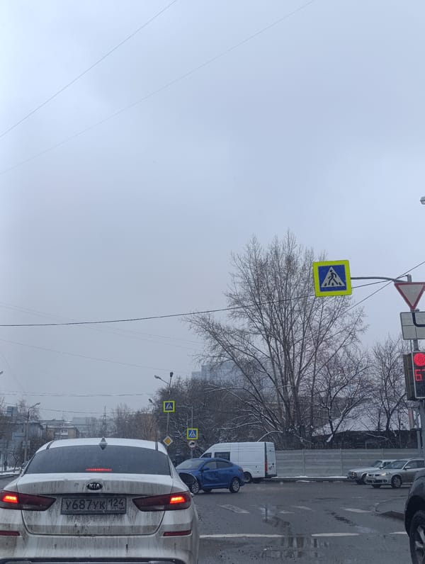Spring snowfall blankets Krasnoyarsk streets, toy car spotted