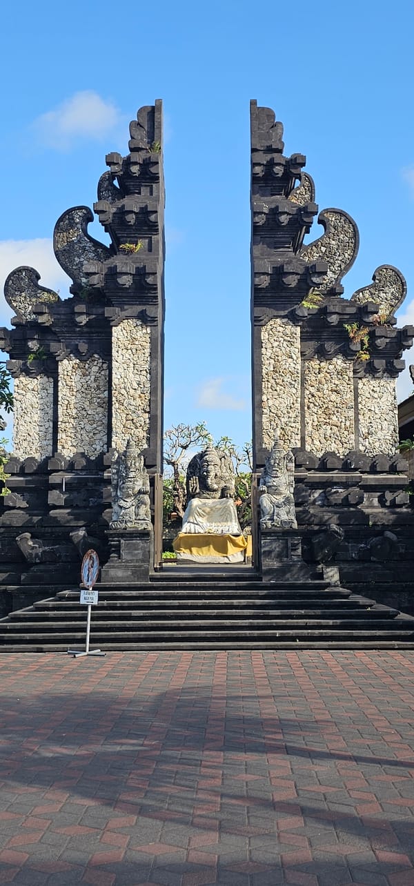 Workers prepare equipment at Balinese temple in Denpasar