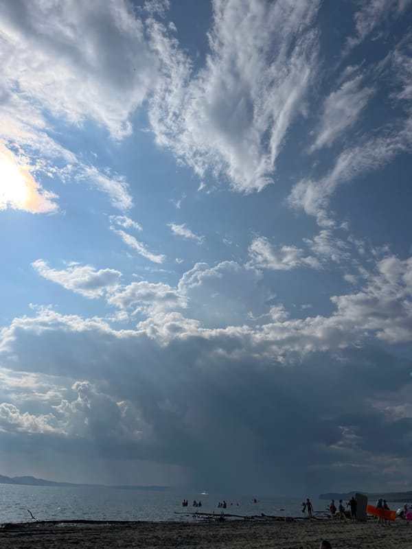 Cloudy summer sky over a lakeside beach in southern Siberia