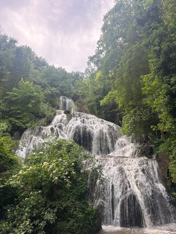 Tourists visit Krushuna Waterfall in Bulgaria, capture scenic views