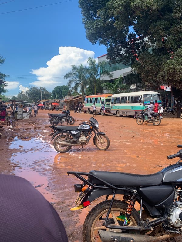 Post-rainfall muddy streets documented across Dar es-Salaam commercial areas