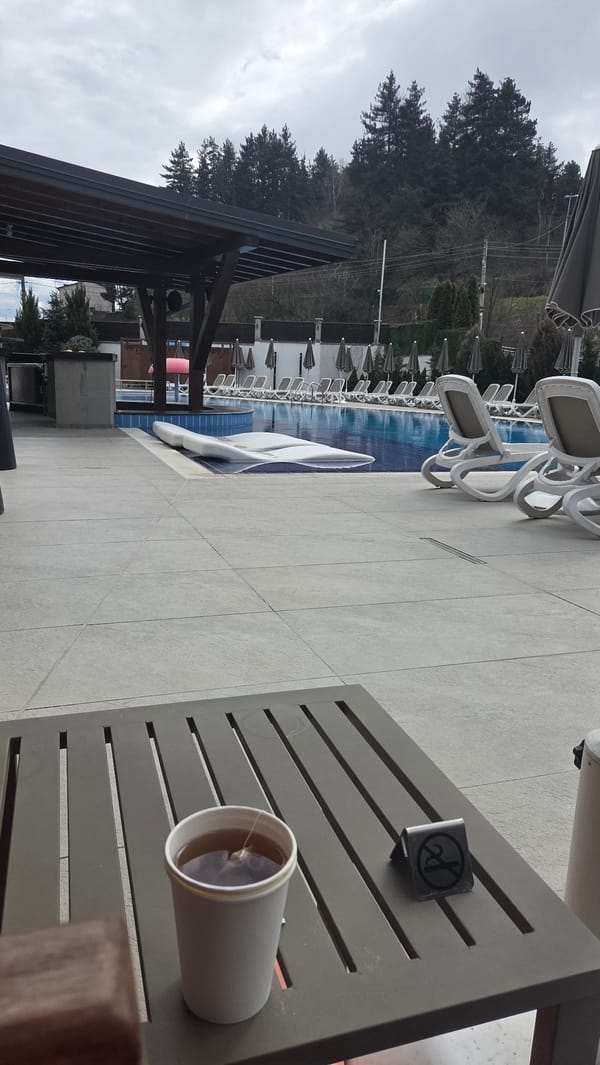 Poolside tea break captured in Bania, Bulgaria