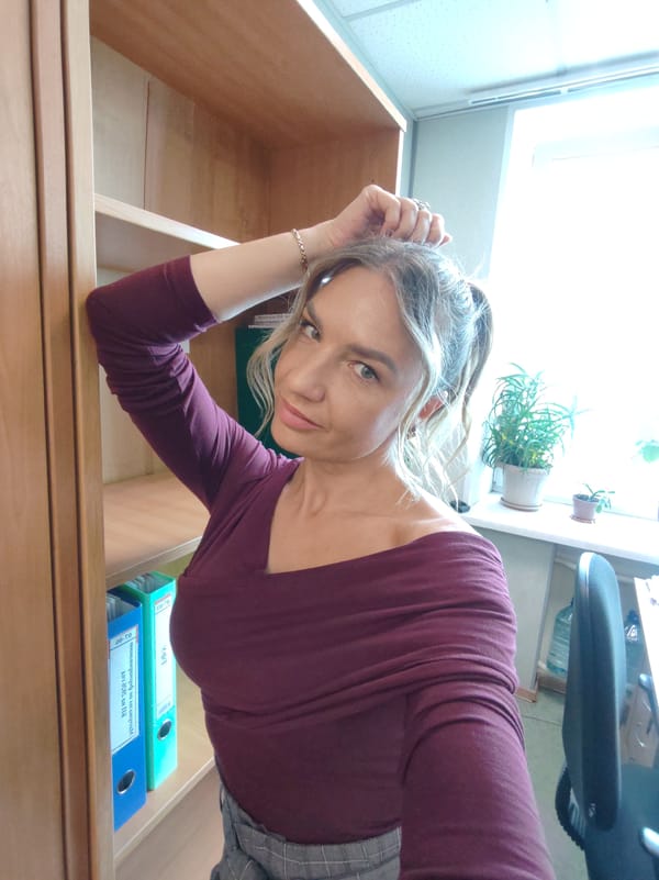Woman poses for photo in office setting