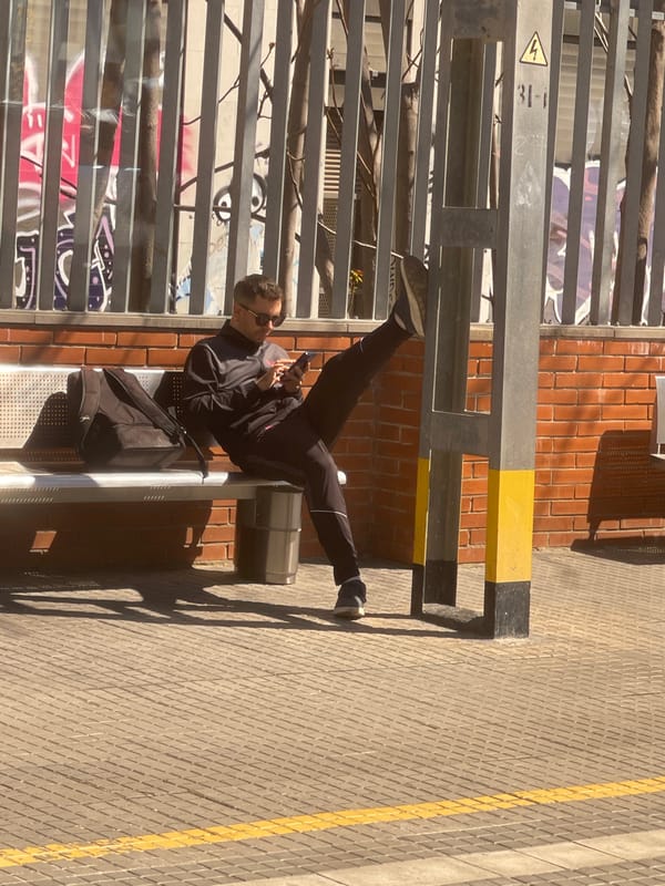 Man sits on public bench in Spanish town