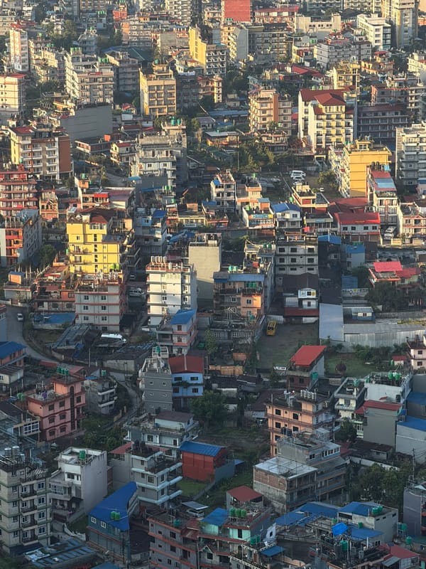Foggy aerial view captured over Pokhara's urban landscape