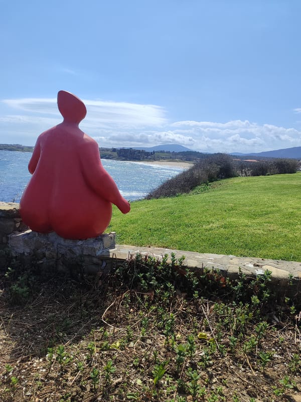 Red woman sculpture overlooks sea in Lozenets, Bulgaria