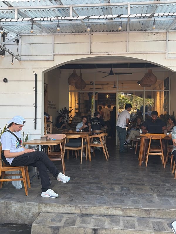 Everyday street life outside Bali's Ngurah Rai immigration office