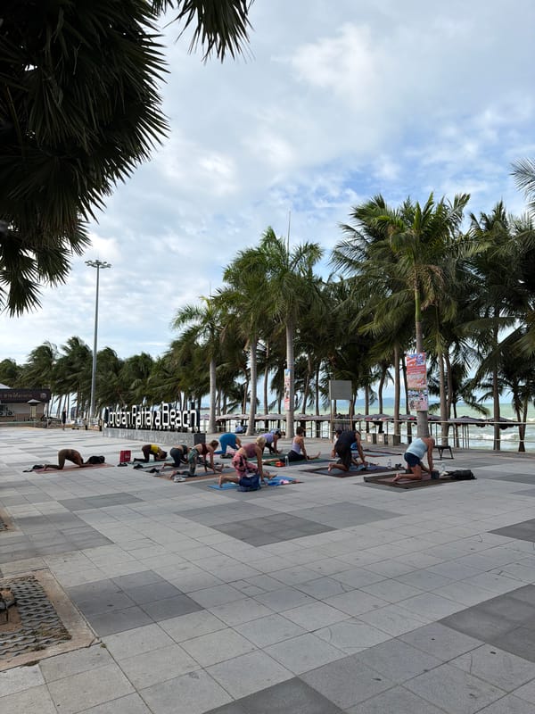 Early morning yoga session held on Pattaya beach promenade
