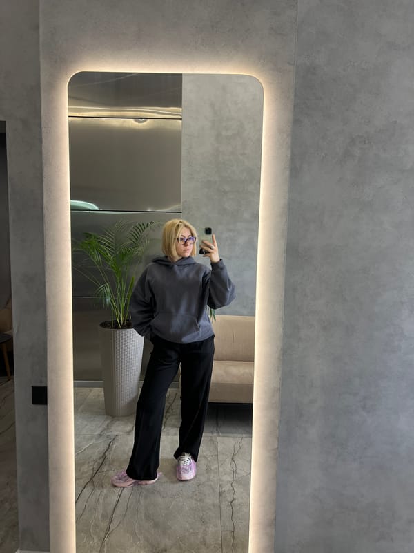 Woman takes mirror selfies in Odesa apartment