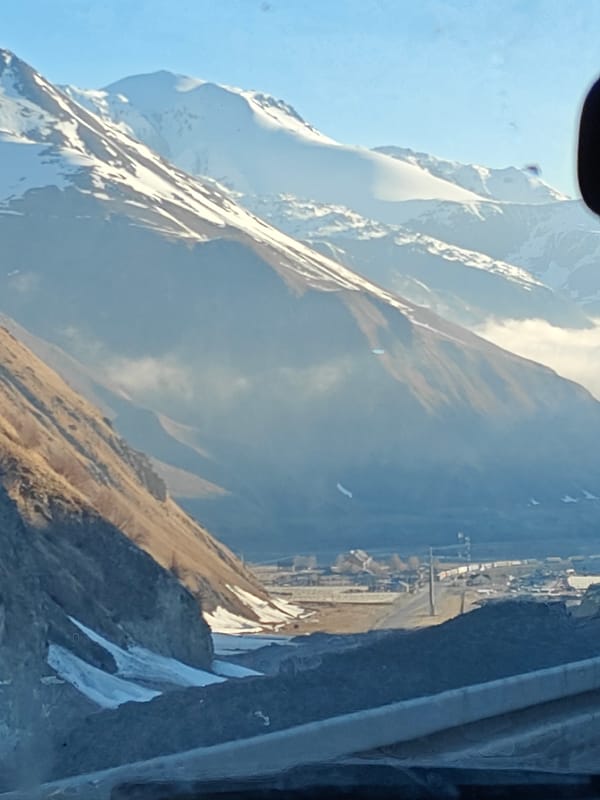 Mountain landscape with snow peaks observed in Almasiani, Georgia