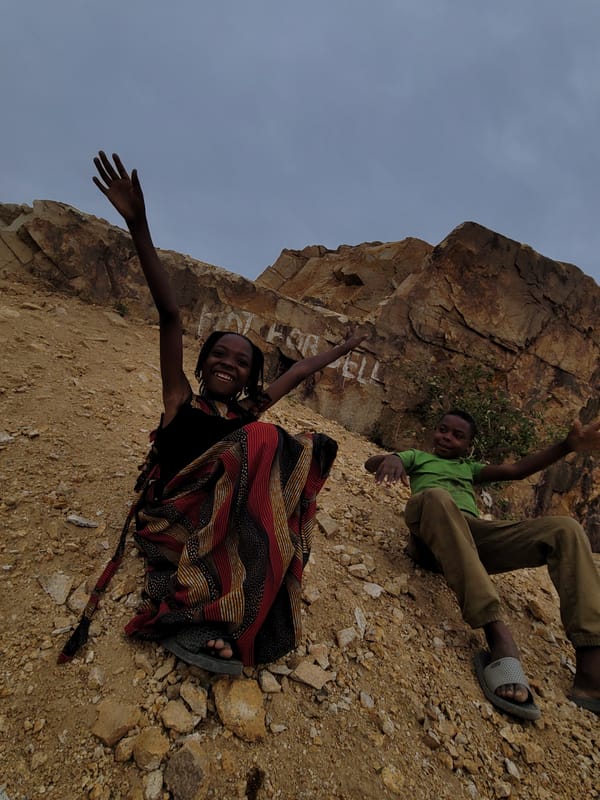 Children play at rocky site in Barakin Akawo, Nigeria