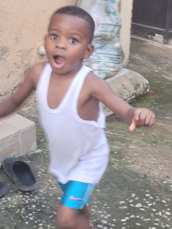 Children and adults photographed in everyday moments across Suleja