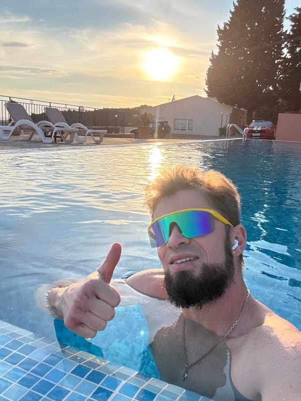 Man enjoys poolside afternoon in Šušanj, Montenegro