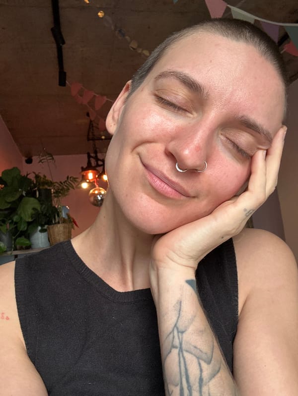 Tattooed individual photographed in quiet morning moments in Batumi