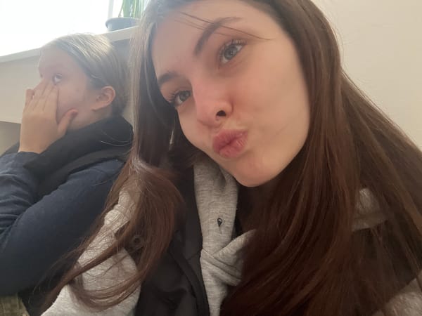 Two women photographed indoors in Saint Petersburg apartment