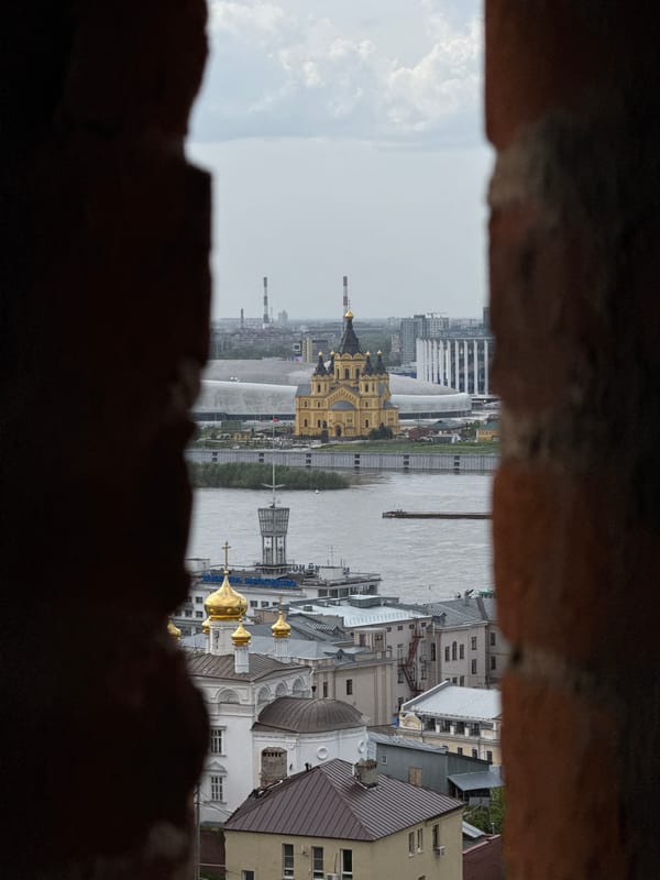 Cityscape viewed through historic fortification opening in Nizhny Novgorod