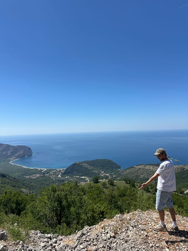 Man enjoys cliff-top coastal view in Brda, Montenegro