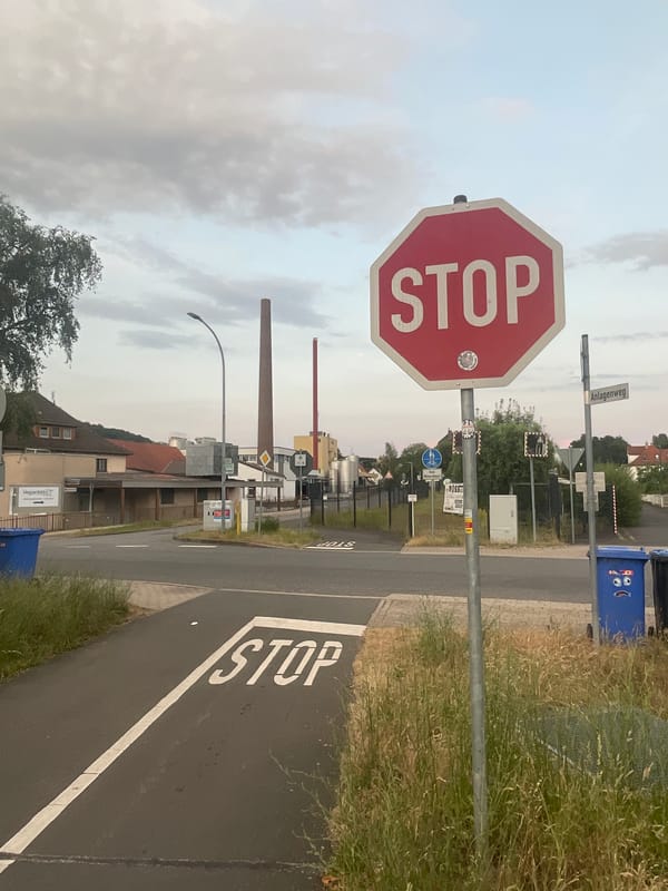 Quiet street-level scenes along a Neukirchen waterway