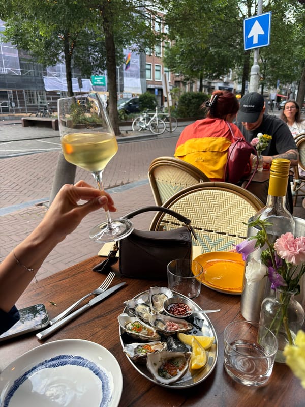 Oysters and wine at a table in Amsterdam