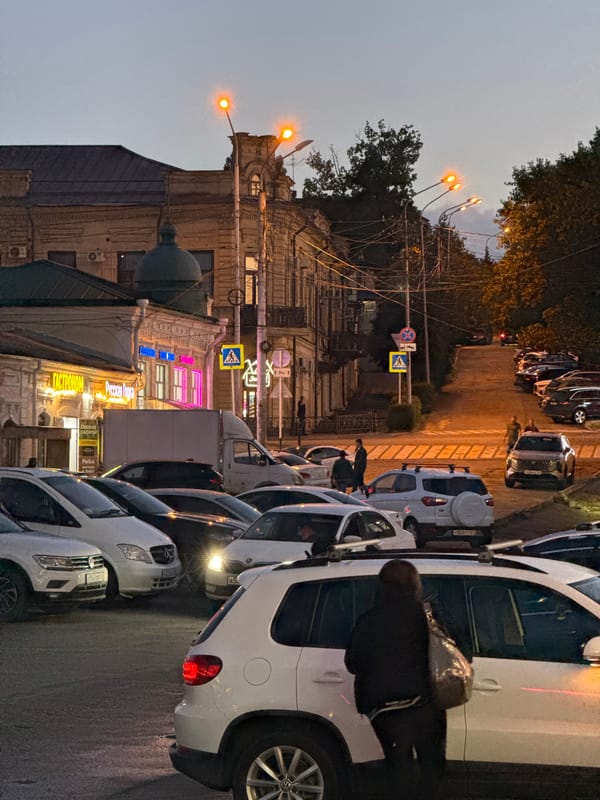 Stavropol commercial district at dusk, storefronts and street life