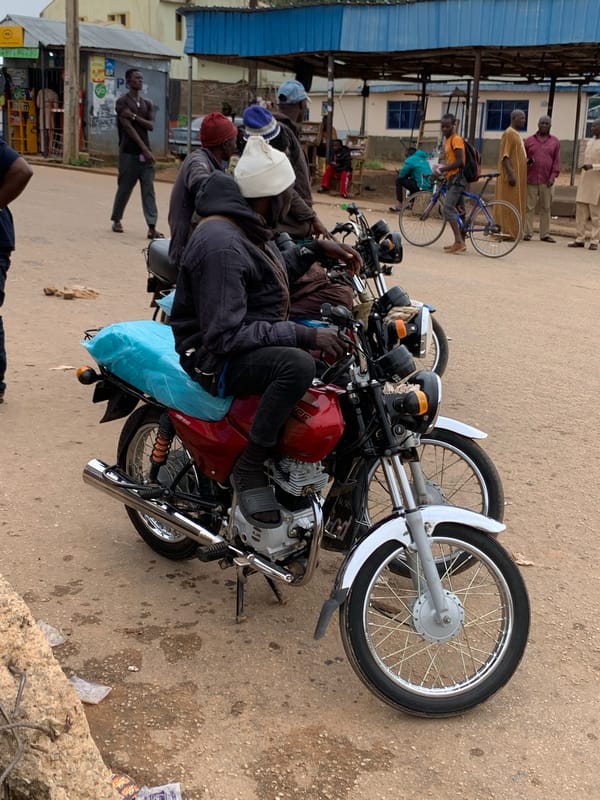 Street life and motorcycle traffic in Gura Top, Nigeria