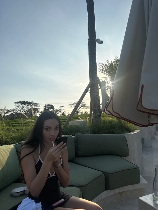Lazy poolside afternoon at a resort, phone in hand