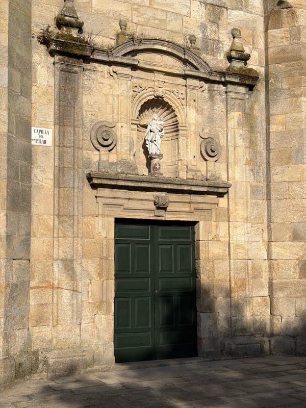 Walking the old stones outside a Santiago church