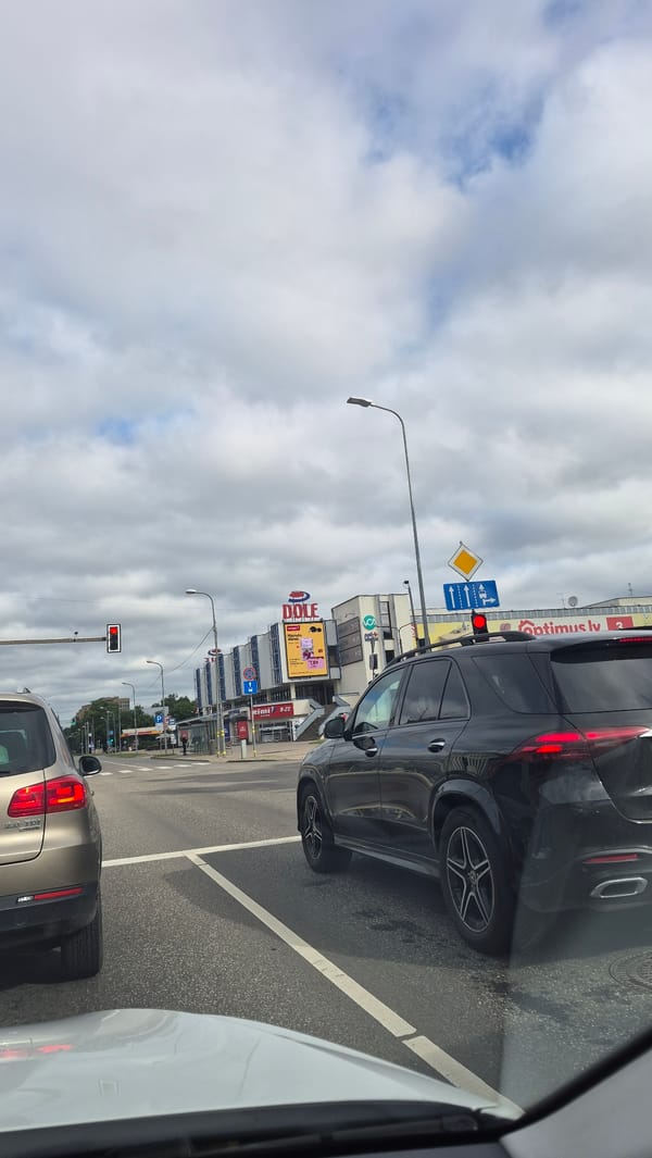 Bolt vehicles lined up on a Riga street on a grey morning