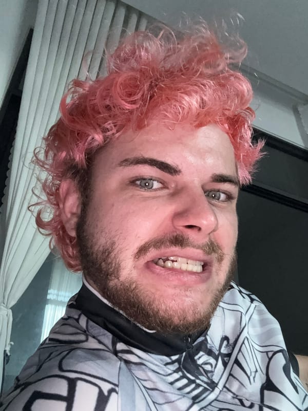 Pink-haired person takes selfie session in Đà Nẵng apartment