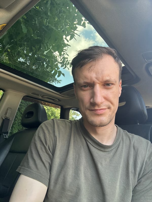 Parked car selfie session in Shatava, sunroof open, energy drink in hand