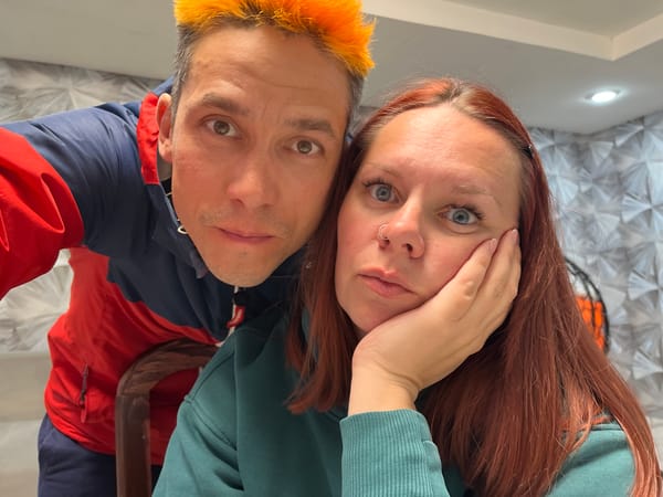 Couple takes playful selfies indoors in Chaikovsky, Russia