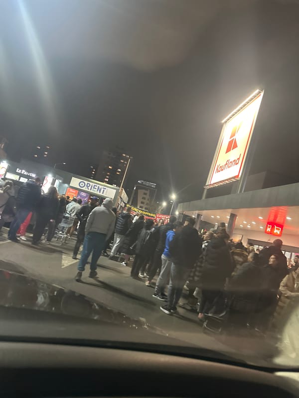 Crowd gathers outside Kaufland supermarket in Plovdiv evening
