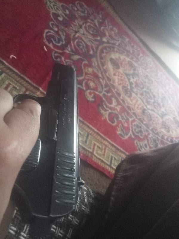 Firearm handling and disassembly documented in Mansehra, Pakistan