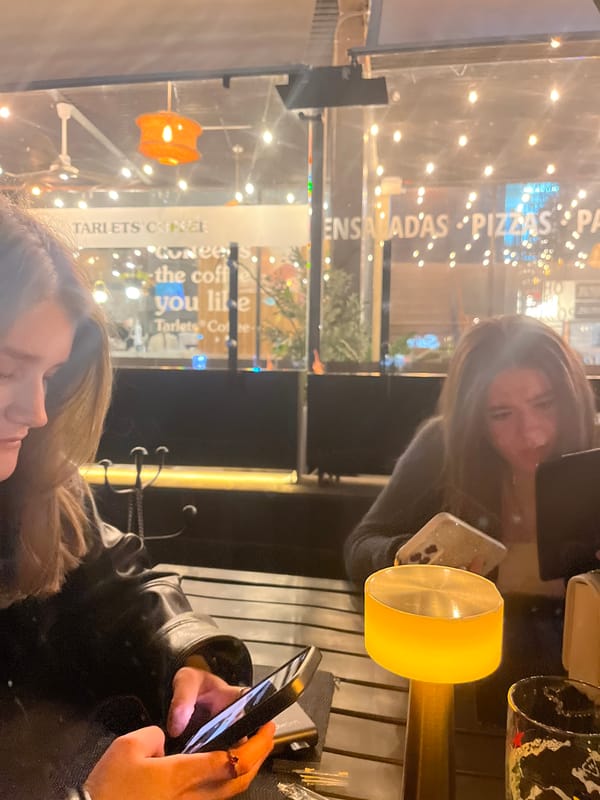Diners use phone during indoor restaurant meal in Mexico