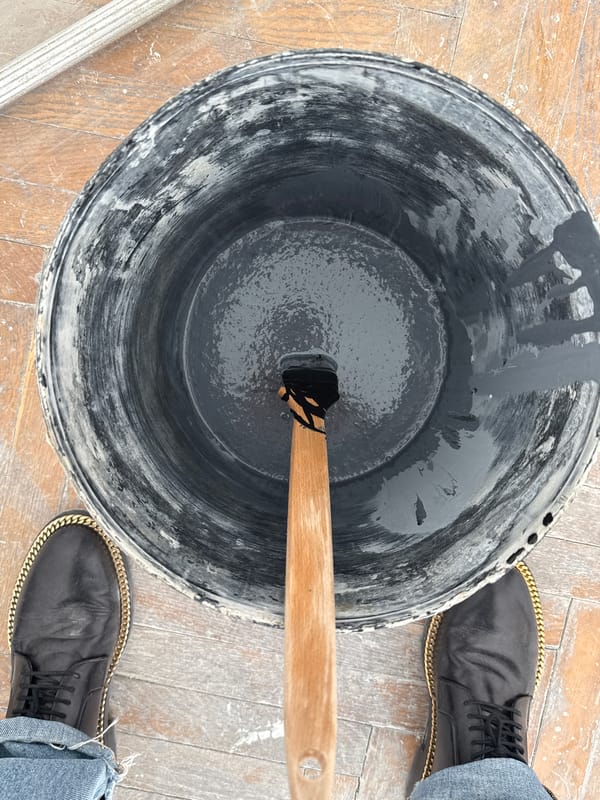 Artist paints colorful rectangular sections in Erba, Italy