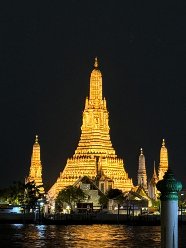 Wat Arun's towering prang glows after dark in Bangkok