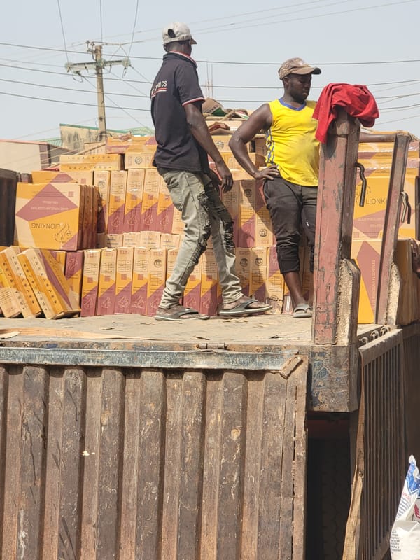 Man photographed outside building in Maiburiji, Nigeria