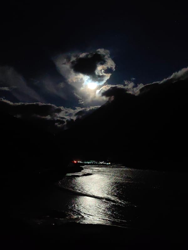 Moonlit water and cloud cover near Sissu, India