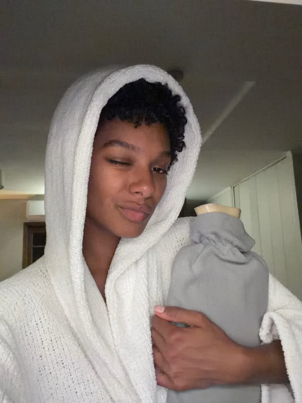 Person photographed in towel at Champs-sur-Marne residence