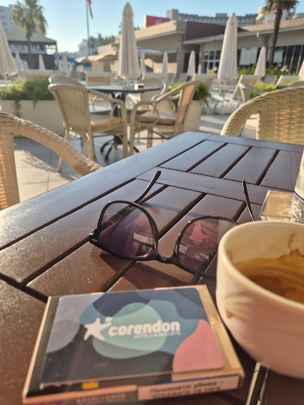 Relaxed outdoor café moment with coffee and a selfie