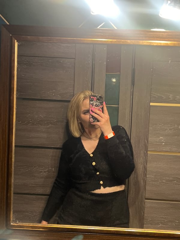 Woman takes mirror selfie in Kingisepp, Russia